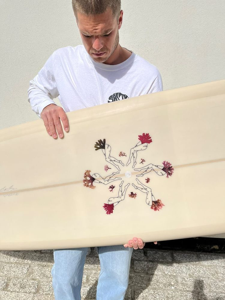 Detail of Salty Sea Legs pressed seaweed surfboard artwork