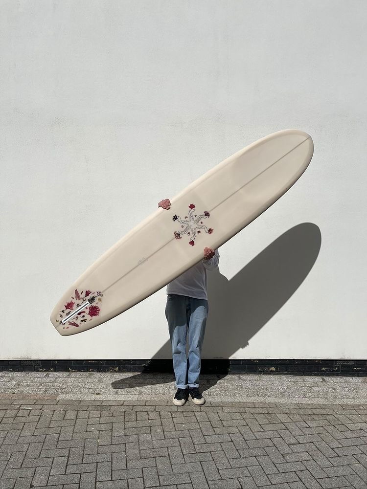 Finished Salty Sea Legs surfboard with pressed seaweed design